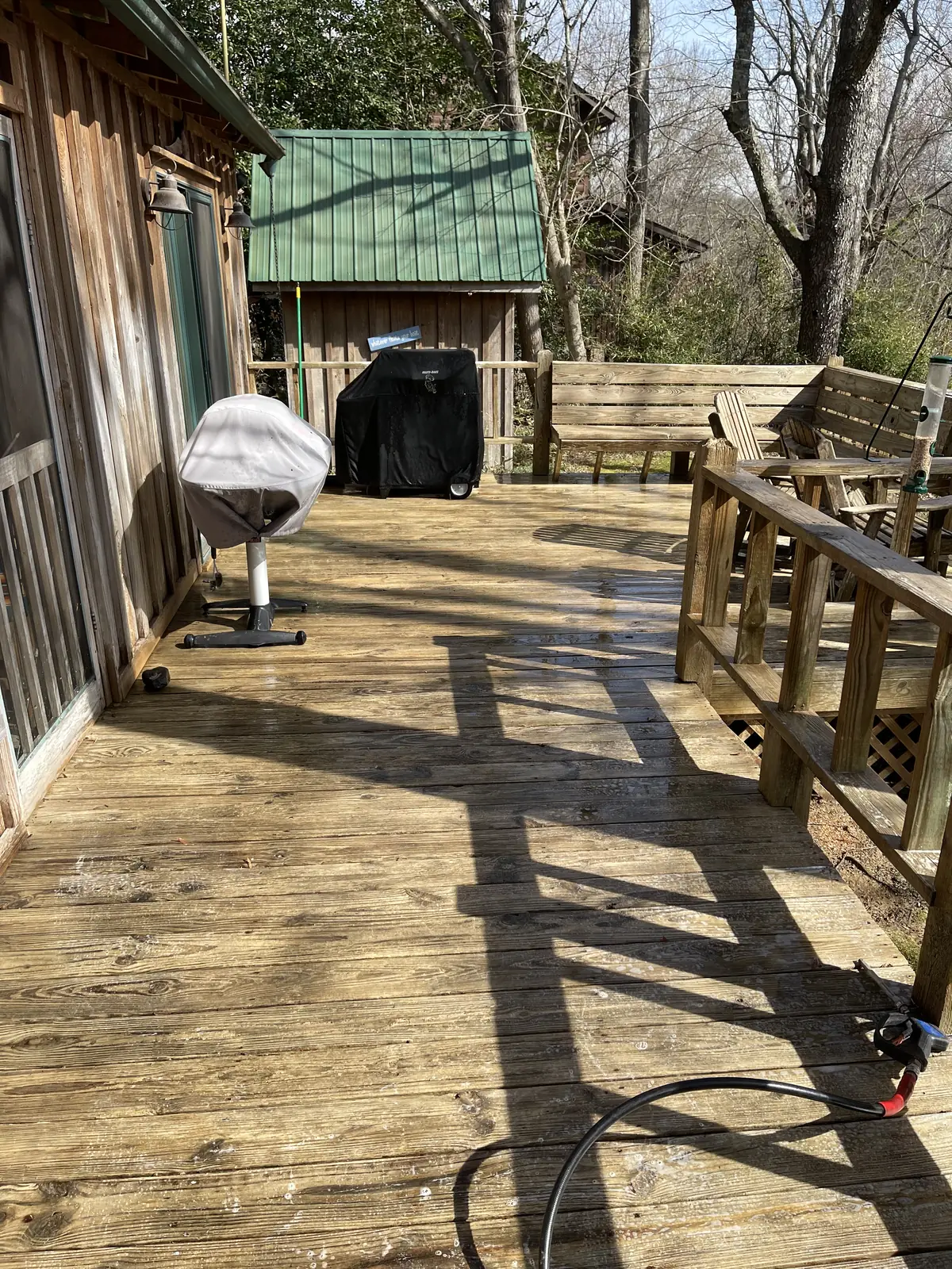 The same deck after cleaning — warm, restored wood grain