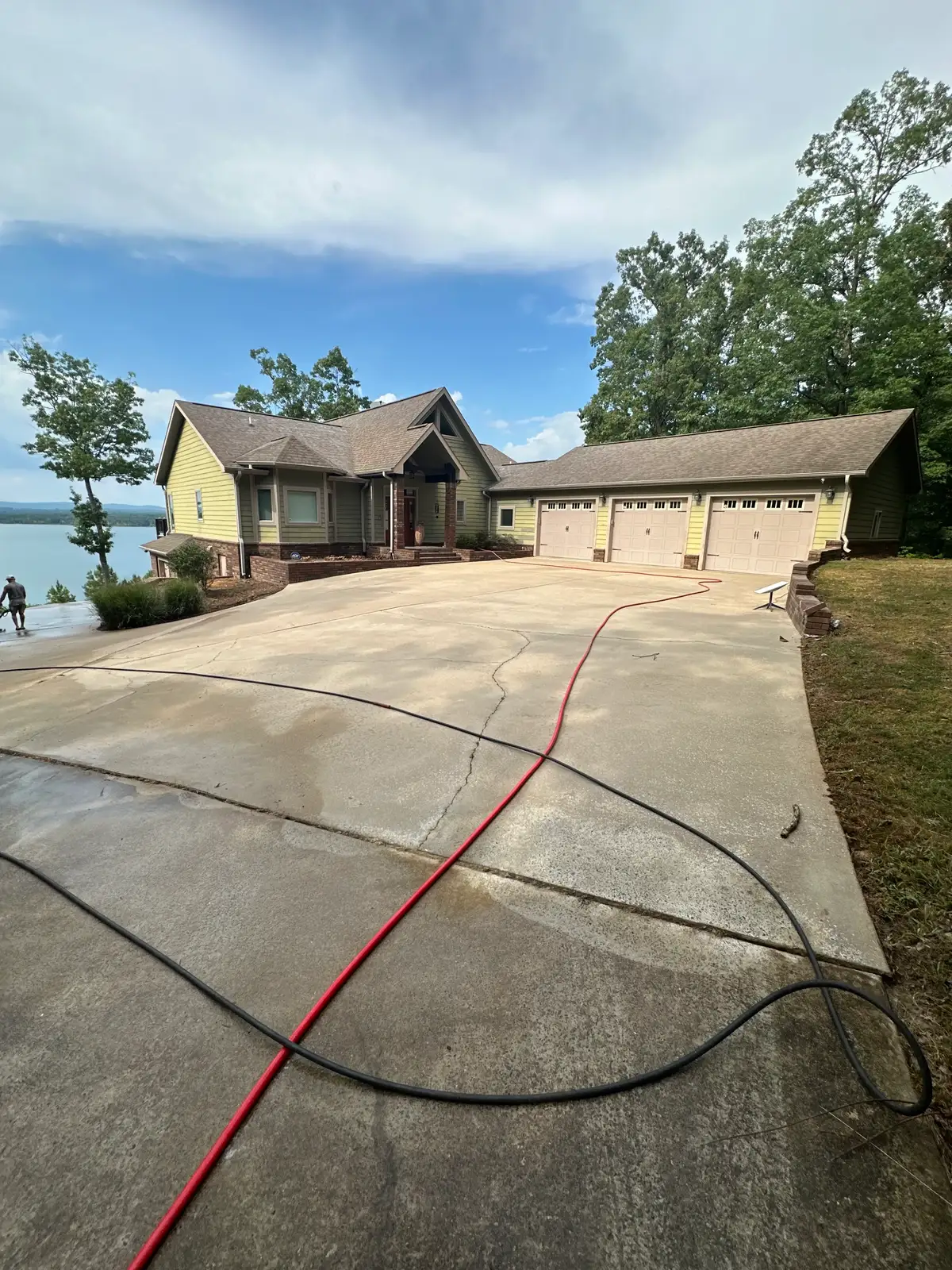 Power washing in progress showing the clean line of professional workmanship